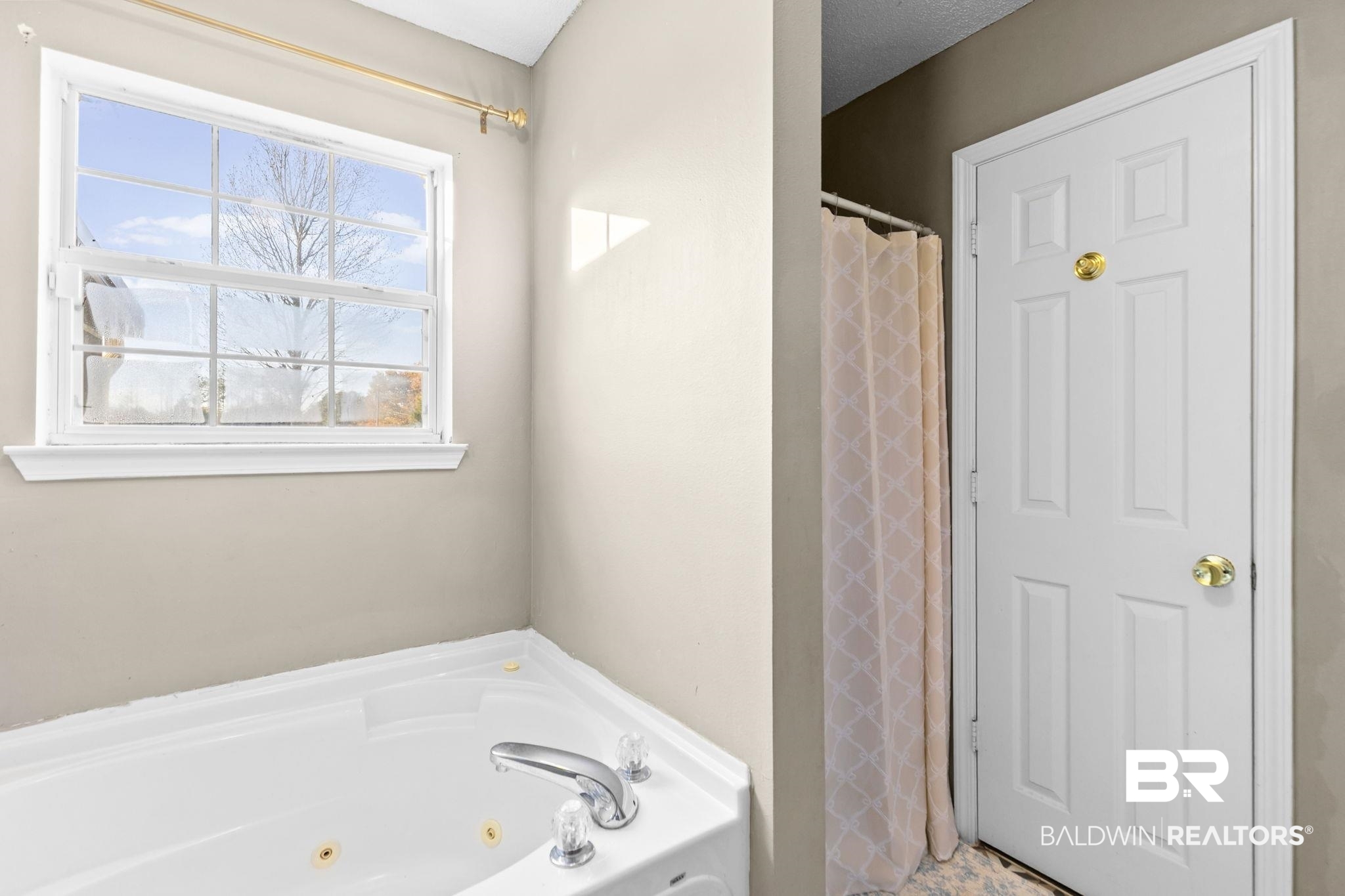 3842 Experiment Farm Road Monroeville, AL 36460 - Photo 37 of 59 Bathroom featuring a shower with curtain, a jetted tub, and a textured ceiling
