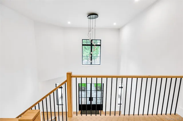a view of an entryway with wooden floor