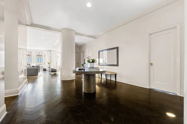 a view of living room filled with furniture and wooden floor