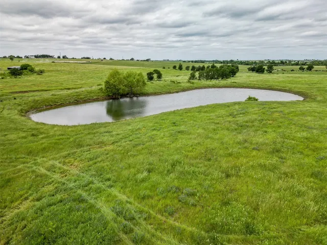 a view of a lake with a big yard