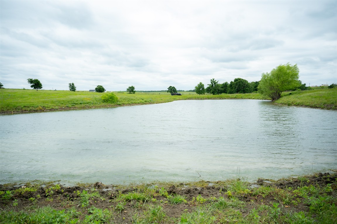 1716 B Cr Coupland, TX 78615 - Photo 29 of 40 a view of a lake with houses in the back