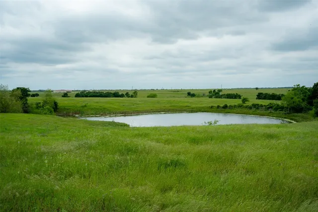 a view of a golf course with a lake