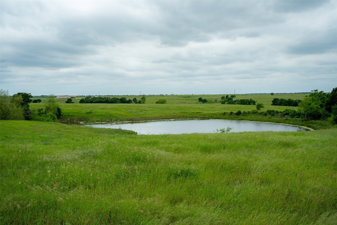 1716 B Cr Coupland, TX 78615 - Photo 32 of 40 a view of a golf course with a lake