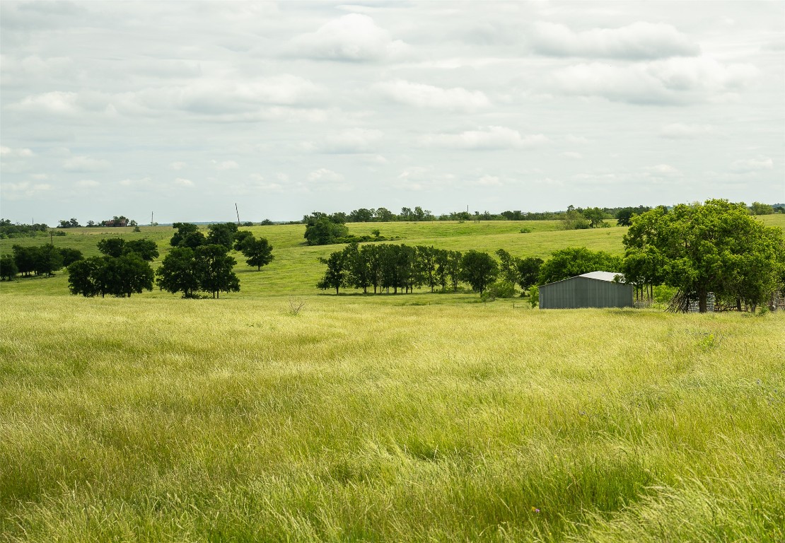 1716 B Cr Coupland, TX 78615 - Photo 8 of 40 a view of a lake with a yard