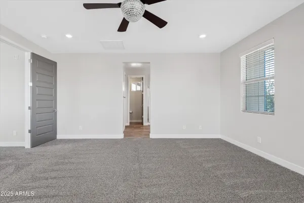 a view of an empty room with a window