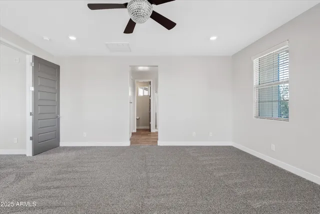 a view of an empty room with a window