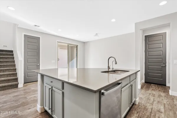 a kitchen with a sink and cabinets