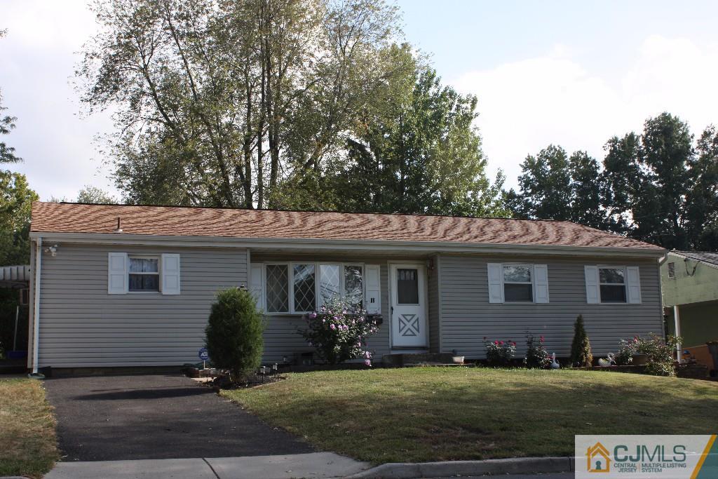 11 Bucknell Road Old Bridge, NJ 08859 - Photo 1 of 16 a front view of a house with a garden