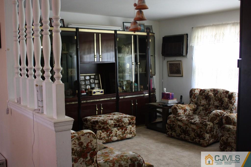 11 Bucknell Road Old Bridge, NJ 08859 - Photo 2 of 16 a living room with furniture and a fireplace