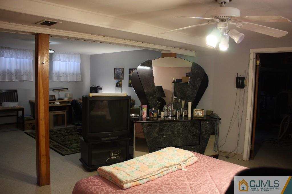 11 Bucknell Road Old Bridge, NJ 08859 - Photo 13 of 16 a bedroom with a bed and a mirror