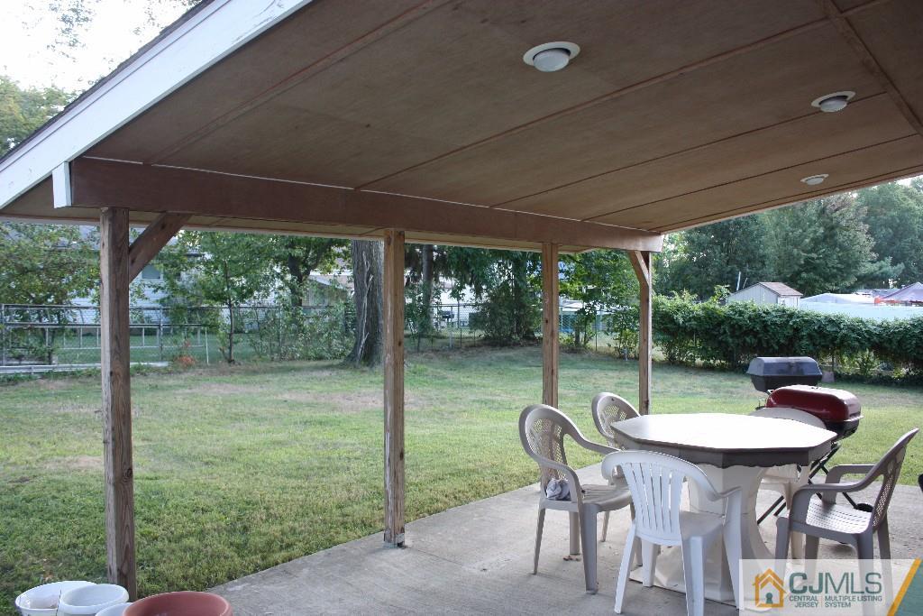 11 Bucknell Road Old Bridge, NJ 08859 - Photo 15 of 16 a table and chairs in the patio