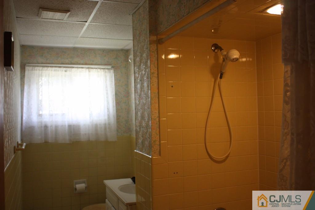 11 Bucknell Road Old Bridge, NJ 08859 - Photo 3 of 16 a bathroom with a shower