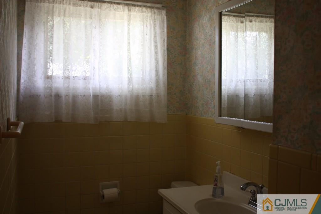 11 Bucknell Road Old Bridge, NJ 08859 - Photo 4 of 16 a bathroom with a sink and a window