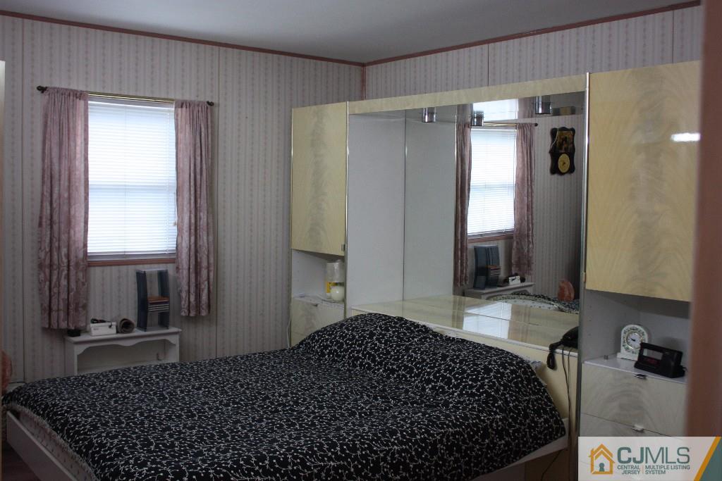 11 Bucknell Road Old Bridge, NJ 08859 - Photo 6 of 16 a bedroom with a bed and a dresser