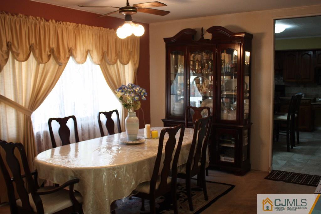 11 Bucknell Road Old Bridge, NJ 08859 - Photo 8 of 16 a view of a dining room with furniture and chandelier