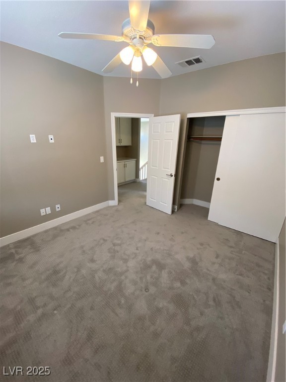 2225 Warm Walnut Drive Las Vegas, NV 89134 - Photo 21 of 38 Unfurnished bedroom featuring light colored carpet, ceiling fan, and a closet
