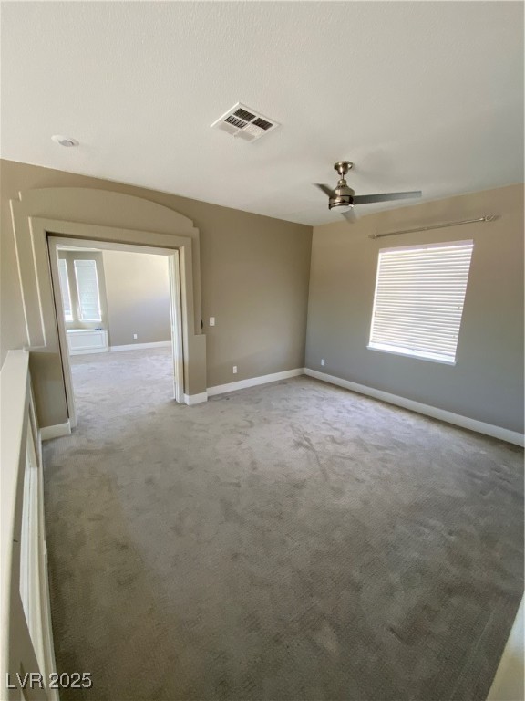 2225 Warm Walnut Drive Las Vegas, NV 89134 - Photo 25 of 38 Empty room with a ceiling fan, light carpet, and a textured ceiling
