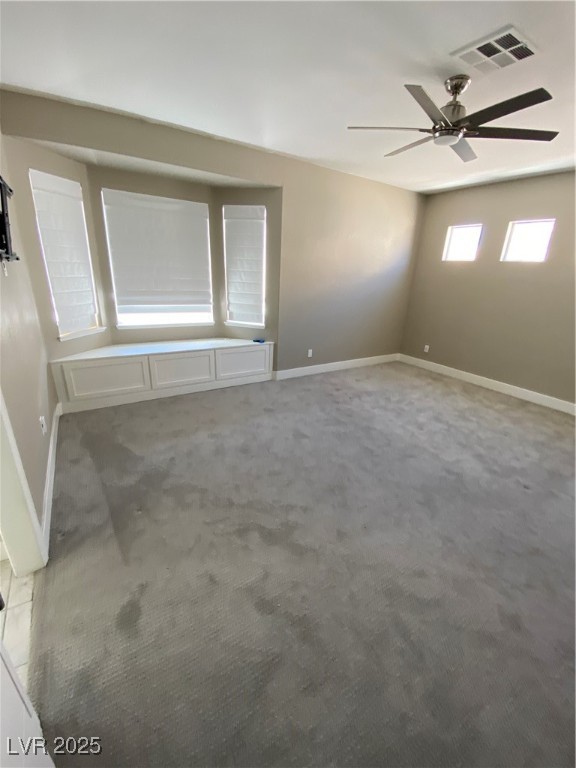 2225 Warm Walnut Drive Las Vegas, NV 89134 - Photo 30 of 38 Carpeted spare room featuring baseboards and ceiling fan