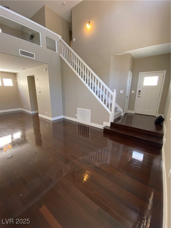 2225 Warm Walnut Drive Las Vegas, NV 89134 - Photo 3 of 38 Foyer featuring plenty of natural light, wood-type flooring, stairway, and a towering ceiling