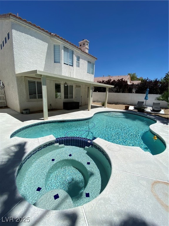 2225 Warm Walnut Drive Las Vegas, NV 89134 - Photo 35 of 38 View of pool featuring a pool with connected hot tub and a patio