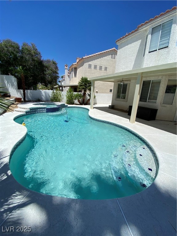 2225 Warm Walnut Drive Las Vegas, NV 89134 - Photo 37 of 38 View of pool featuring a patio and a pool with connected hot tub