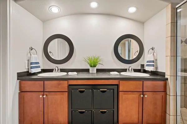 a bathroom with a toilet a sink and a mirror