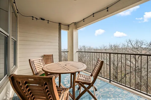 a view of a balcony with chair and the floor