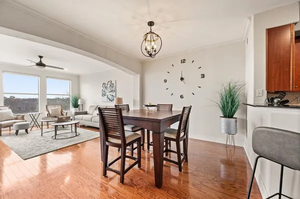 a view of a dining room with furniture window and wooden floor