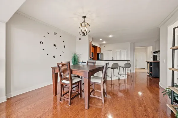 a view of a dining room with furniture and wooden floor
