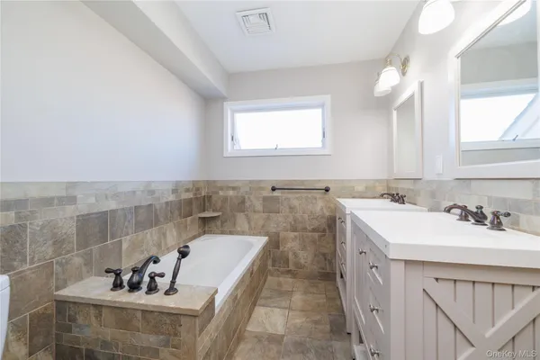 a bathroom with a sink and a bathtub