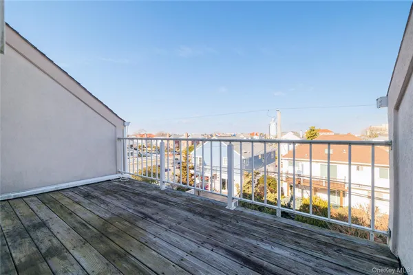 a view of balcony with wooden floor