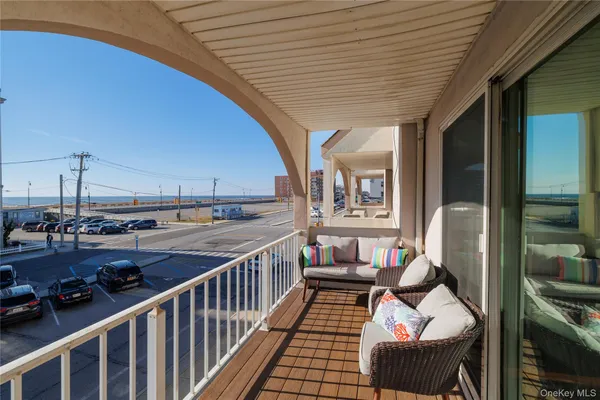 a view of a balcony and chairs
