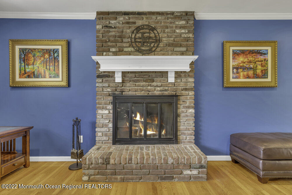 960 Farmingdale Road Jackson, NJ 08527 - Photo 15 of 39 a bedroom with a bed and a fireplace