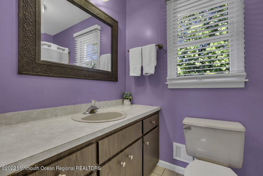 960 Farmingdale Road Jackson, NJ 08527 - Photo 18 of 39 a bathroom with a sink a toilet and mirror