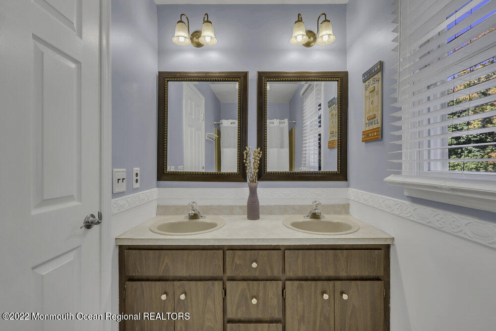 960 Farmingdale Road Jackson, NJ 08527 - Photo 19 of 39 a bathroom with a sink and a mirror