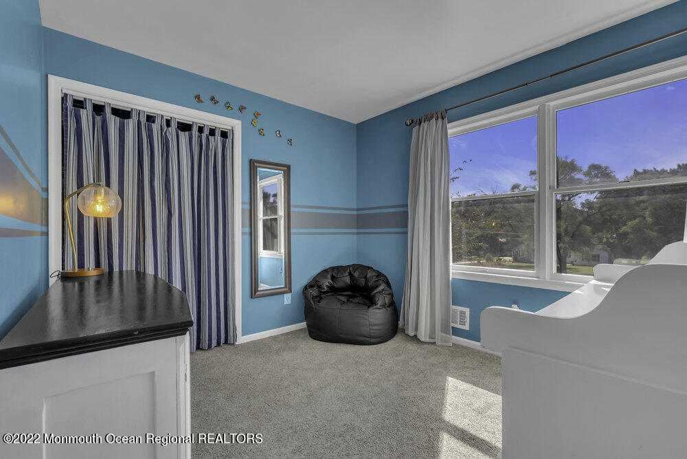 960 Farmingdale Road Jackson, NJ 08527 - Photo 20 of 39 a living room with furniture and floor to ceiling window