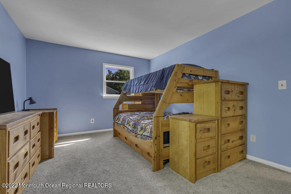 960 Farmingdale Road Jackson, NJ 08527 - Photo 22 of 39 a bed room with a bed and a dresser