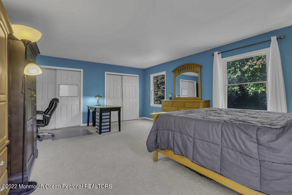 960 Farmingdale Road Jackson, NJ 08527 - Photo 25 of 39 a bedroom with a bed a dresser next to a window