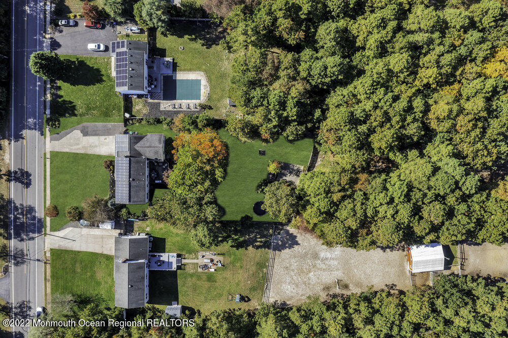 960 Farmingdale Road Jackson, NJ 08527 - Photo 36 of 39 an aerial view of a house with a yard and lake view