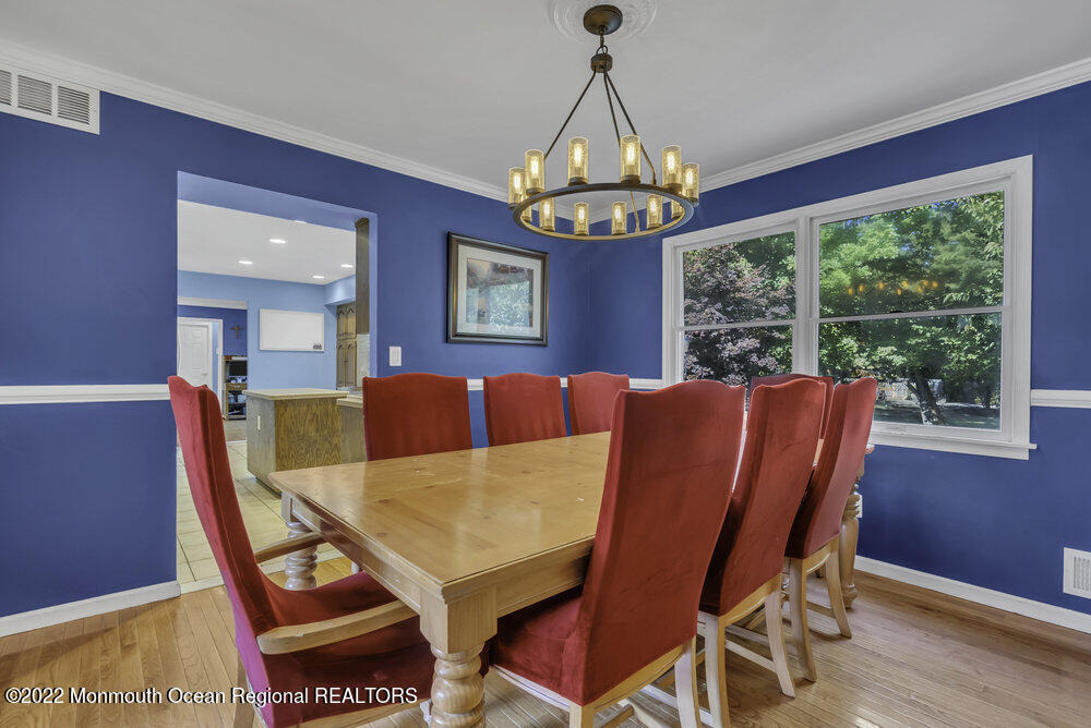 960 Farmingdale Road Jackson, NJ 08527 - Photo 8 of 39 a view of a dining room with furniture wooden floor and chandelier