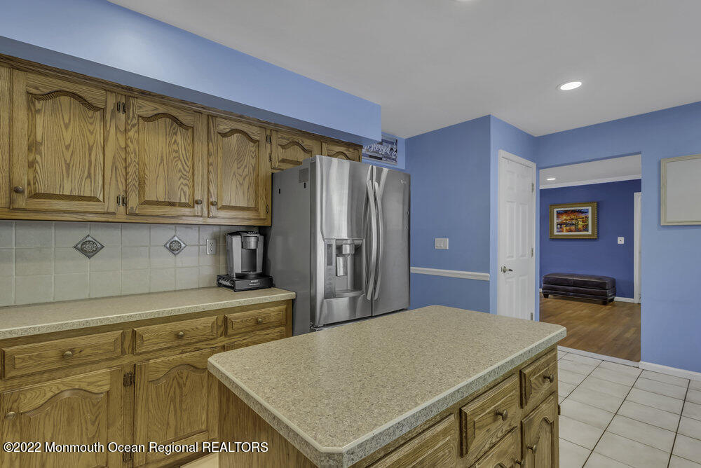 960 Farmingdale Road Jackson, NJ 08527 - Photo 10 of 39 a kitchen with stainless steel appliances a stove a refrigerator and cabinets