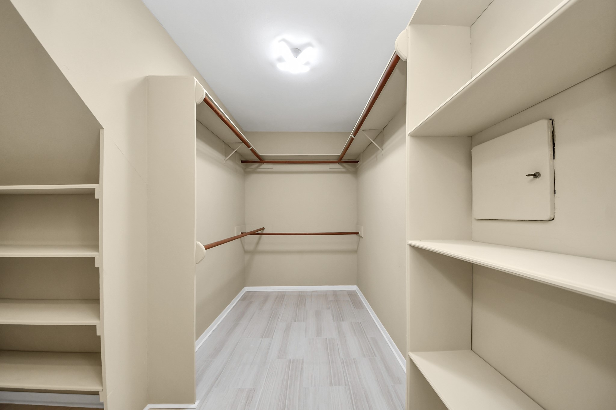 5 Tiffany Square Sugar Land, TX 77478 - Photo 18 of 32 a view of walk in closet with empty racks