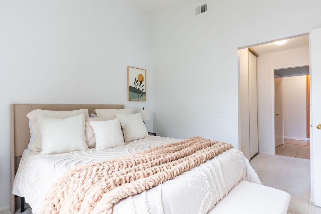 34565 Pueblo Terrace Fremont, CA 94555 - Photo 14 of 18 a bedroom with a bed and painting on the wall