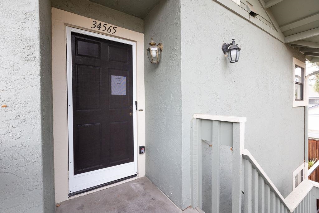 34565 Pueblo Terrace Fremont, CA 94555 - Photo 3 of 18 a view of a hallway with wooden floor