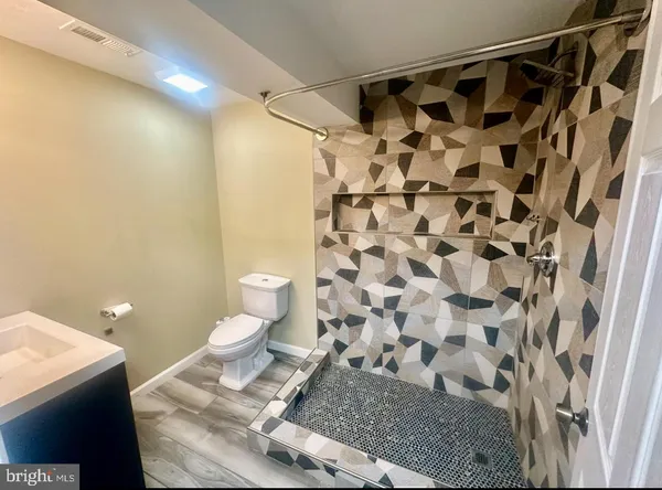 a bathroom with a sink and a toilet