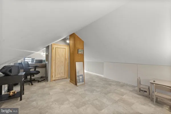 a view of a backyard with sitting area