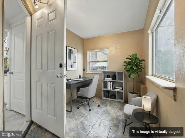 a view of a yard with wooden fence