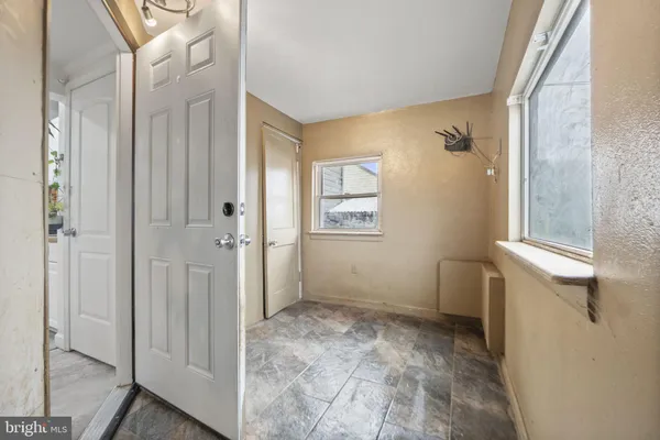 a view of a backyard with wooden fence