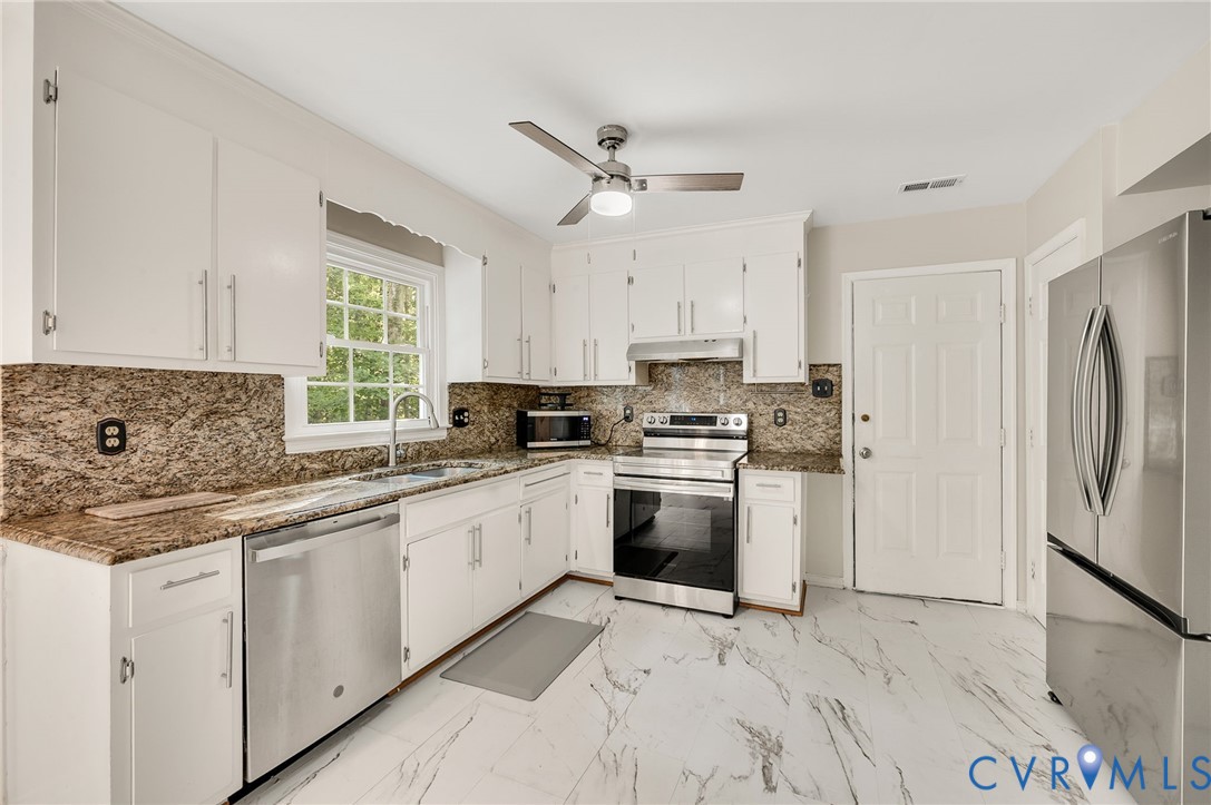 4820 Cedar Cliff Road Chester, VA 23831 - Photo 14 of 41 Kitchen featuring white cabinetry, granite counter