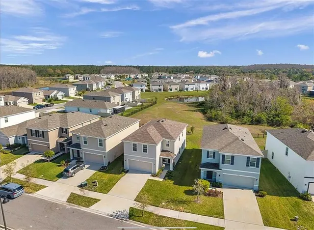an aerial view of a house with a garden
